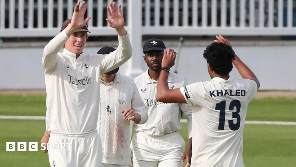 Kent players celebrating their victory and promotion during the County Championship match against Gloucestershire.